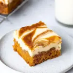 Delicious carrot cake cheesecake bars with cream cheese frosting