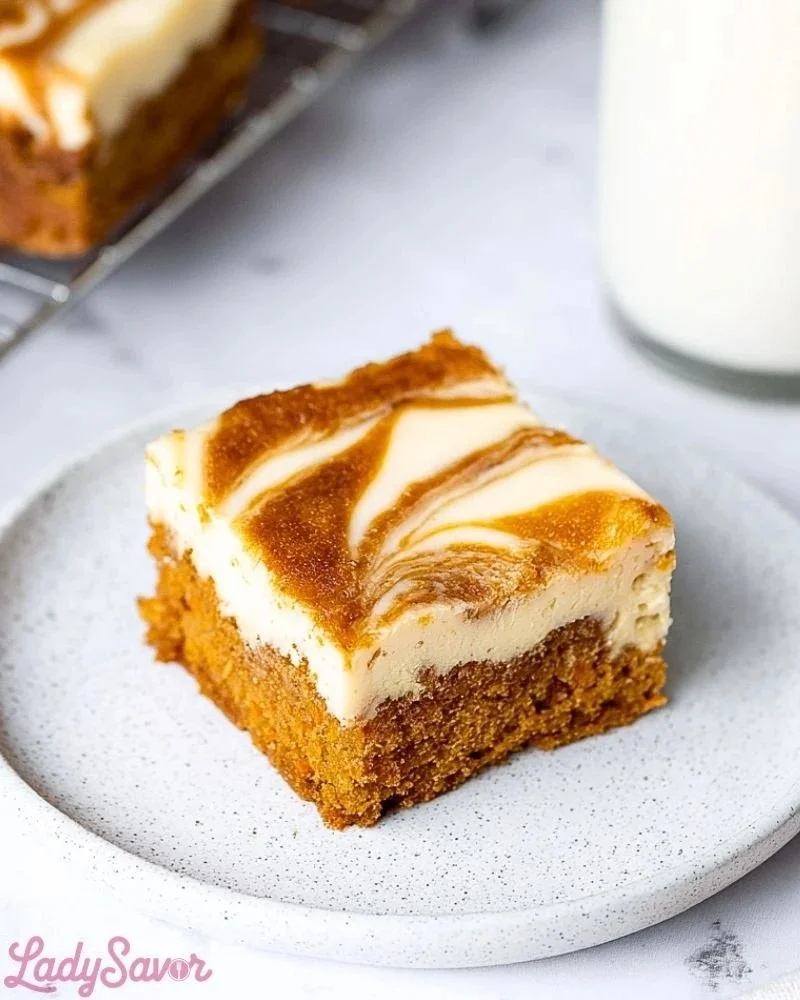 Delicious carrot cake cheesecake bars with cream cheese frosting